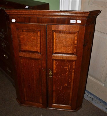 Lot 1398 - Georgian oak hanging corner cupboard