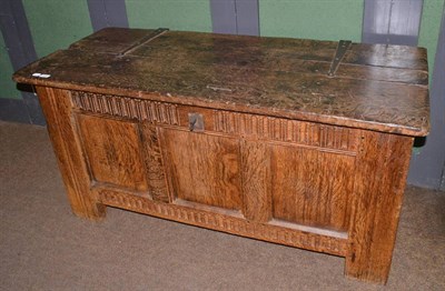 Lot 1408 - An 18th century panelled oak blanket chest with plank top