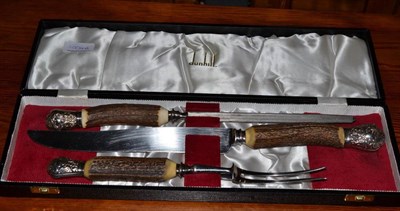 Lot 1004A - A cased Dunhill antler handled three piece carving set