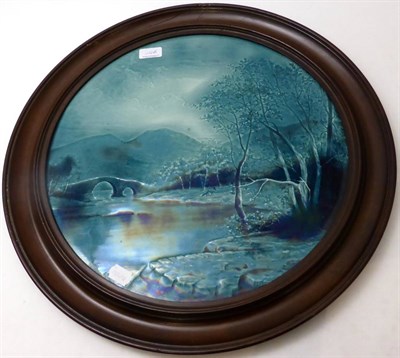 Lot 64A - A Burmantofts Faience Pottery Circular Plaque, moulded with a river landscape, turquoise glaze,...