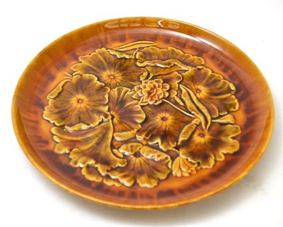 Lot 68A - 658 Christopher Dresser for Linthorpe Pottery: A Charger, shape No.658, moulded with leaves,...