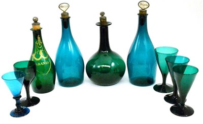 Lot 7 - A tray of green glass including spirit decanters with stoppers and wine glasses