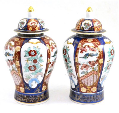 Lot 34 - A pair of Chinese Imari vases and covers