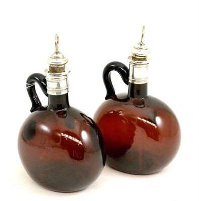 Lot 41 - A pair of amber glass flagons