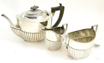 Lot 48 - A silver three piece tea service, Birmingham 1915 and Sheffield 1910