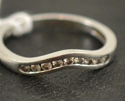 Lot 108 - A platinum diamond shaped band ring, total estimated diamond weight, 0.20 carat approximately
