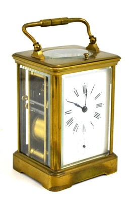 Lot 119 - A brass quarter striking and repeating carriage clock with alarm