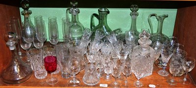 Lot 134 - Shelf of assorted drinking glasses, decanters and stoppers etc