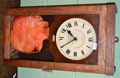 Lot 147 - Gledhill time clock and an oil lamp