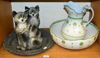 Lot 162 - A jug and bowl, pair of cats, pewter dish
