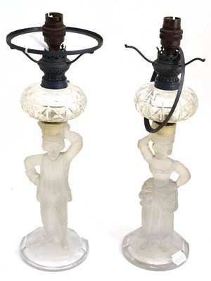 Lot 202 - A pair of glass figural oil lamp bases