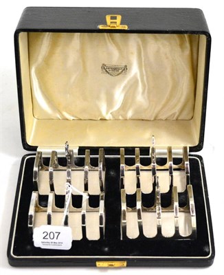 Lot 207 - Cased set of four silver toast racks