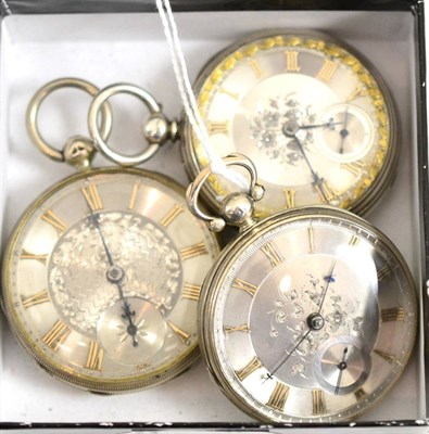 Lot 232 - Three silver open faced pocket watches, with engine turned silvered dials (3)