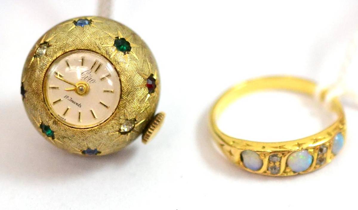 Lot 254 - A ball pendant watch on chain, a gold coloured ring set with three blue/green opal and diamond...