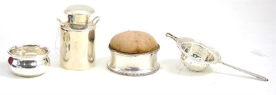 Lot 258 - Silver Guernsey milk can, tea strainer and a pin cushion