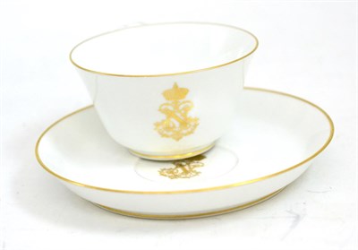 Lot 272 - Sevres Napoleon III tea cup and saucer, in white and gold, from the Imperial household service