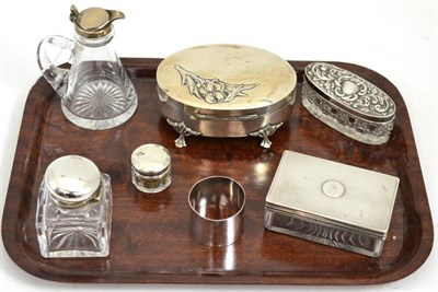 Lot 276 - Silver and glass whisky tot, three silver topped jars, silver napkin ring, silver topped...