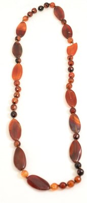 Lot 302 - A Cornelian necklace and earring set (one necklace panel with chip)