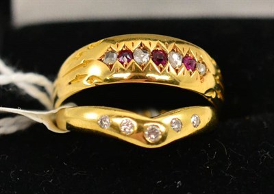 Lot 308 - A 15ct gold ruby and diamond ring and a diamond set wishbone shaped ring (2)