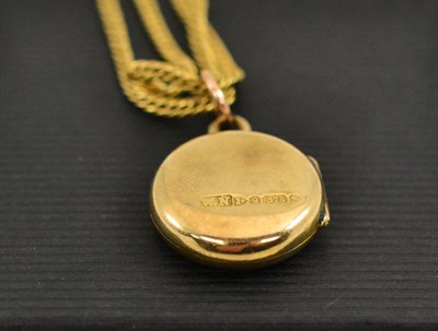 Lot 312 - A locket pendant on a two row chain