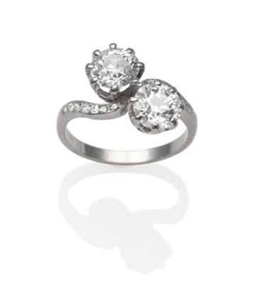 Lot 184 - A Diamond Two Stone Twist Ring, two old cut diamonds in white claw settings, to twist shoulders...