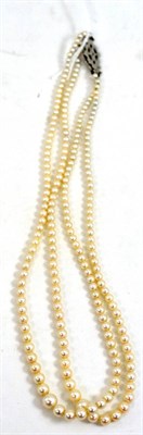 Lot 341 - A two row cultured pearl necklace with 9ct white gold diamond set catch