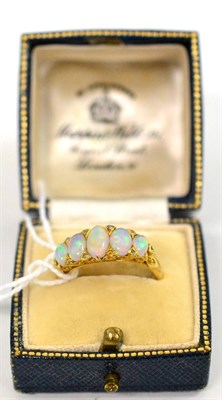 Lot 346 - An opal five stone ring with pairs on tiny rose cut diamonds between (one missing)