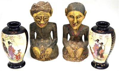 Lot 367 - Two Indonesian carved and painted seated figures and a pair of Japanese Satsuma vases (4)