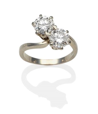 Lot 190 - A Diamond Two Stone Twist Ring, two round brilliant cut diamonds in white claw settings, to...