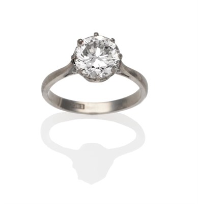 Lot 194 - A Diamond Solitaire Ring, a round brilliant cut diamond in a white claw setting, to knife edge...
