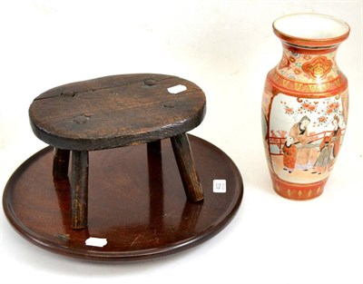 Lot 402 - Mahogany Lazy Susan, primitive elm stool and Kutani vase (3)