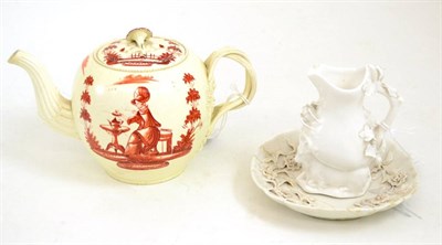 Lot 406 - A Creamware teapot and cover, circa 1760, painted in monochrome red with Miss Pitt taking tea, 13cm