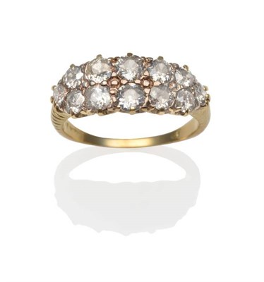 Lot 195 - A Diamond Two Row Ring, twelve old cut diamonds in yellow claw settings to scroll shoulders on...
