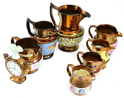 Lot 409 - A quantity of copper lustre including a vase modelled as a clock, a footed bowl, jugs, teapots...