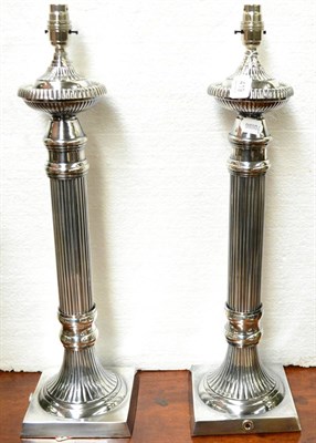 Lot 419 - Pair of lamps on reeded column bases