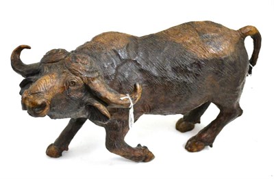 Lot 421 - An African carved wood figure of a standing buffalo