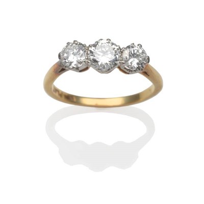 Lot 197 - A Diamond Three Stone Ring, three round brilliant cut diamonds in white claw settings, on a...