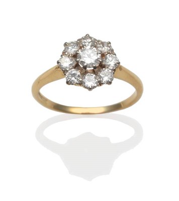 Lot 200 - A Diamond Cluster Ring, a round brilliant cut diamond within a border of smaller round...