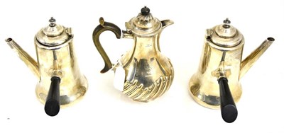 Lot 476 - A pair of silver Cafe au Lait pots and a silver hot water jug