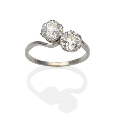 Lot 204 - A Diamond Two Stone Twist Ring, two old cut diamonds in white double claw settings, to twist...