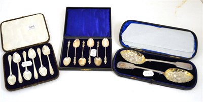 Lot 489 - A pair of Victorian silver berry spoons, Exeter 1871, fiddle pattern and in fitted case, a set...