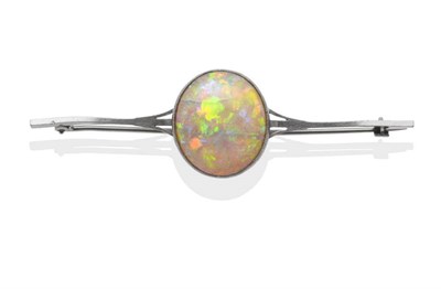 Lot 205 - An Opal Bar Brooch, an oval cabochon opal in a white milgrain setting, to a forked bar,...