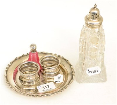 Lot 517 - Silver dish, Birmingham, two silver napkin rings, silver top caster and a silver top pepperette