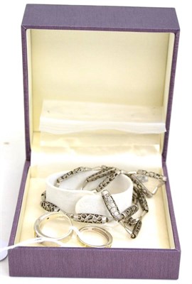 Lot 524 - A 9ct gold diamond set band ring, a silver 'design' ring and a necklace and bracelet set