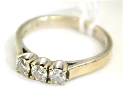 Lot 525 - A 9ct gold diamond three stone ring, total estimated diamond weight 0.30 carat approximately