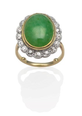 Lot 209 - A Jade and Diamond Cluster Ring, an oval cabochon jade in a yellow rubbed over setting, within...