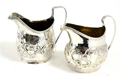 Lot 550 - Two George III silver cream helmets, London 1807 and 1812