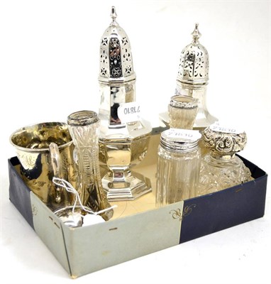 Lot 557 - A group of silver including two sugar casters, a Christening mug, toilet jars, etc