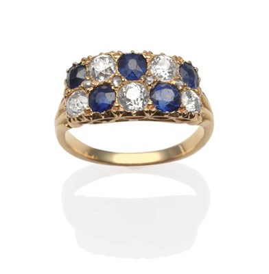 Lot 218 - A Sapphire and Diamond Two Row Ring, round cut sapphires alternate with old cut diamonds and spaced