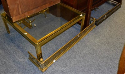 Lot 1019 - A modern glass topped brass lacquered coffee table, a pierced brass fender and a Victorian...